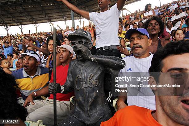 Statue of Cuba's most famous baseball fan, Armando Luis Torres Torres, displays amongst Cuban baseball fans following a training match of Cuba's...