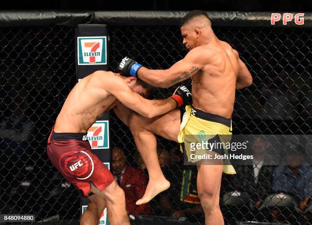 Gilbert Burns of Brasil lands a knee to the head of Jason Saggo of Canada in their lightweight bout during the UFC Fight Night event inside the PPG...