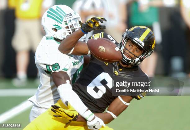 Defensive back Kemon Hall of the North Texas Mean Green breaks up a pass in the fourth quarterintended for wide receiver Ihmir Smith-Marsette of the...