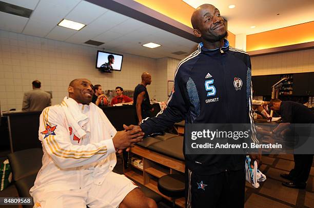 Western Conference Kobe Bryant of the Los Angeles Lakers greets Eastern Conference All-Star Kevin Garnett of the Boston Celtics during the 58th NBA...