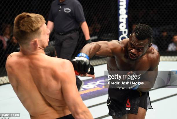 Uriah Hall of Jamaica punches Krzysztof Jotko of Poland in their middleweight bout during the UFC Fight Night event inside the PPG Paints Arena on...