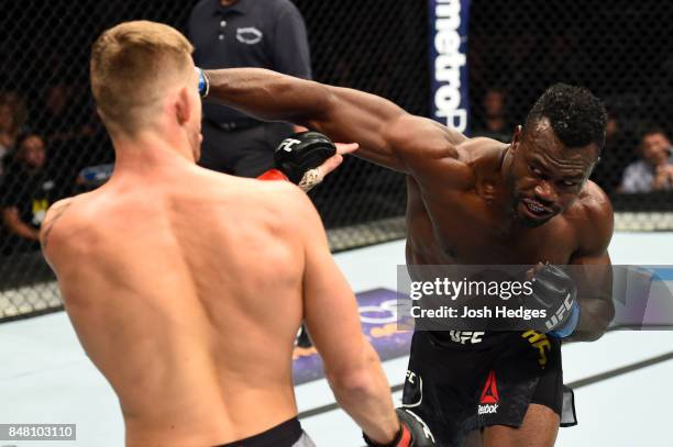 Uriah Hall of Jamaica punches Krzysztof Jotko of Poland in their middleweight bout during the UFC Fight Night event inside the PPG Paints Arena on...