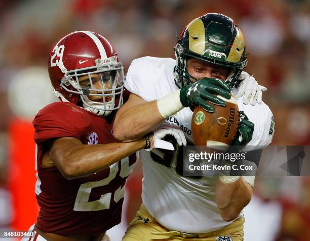 Dalton Fackrell of the Colorado State Rams pulls in this reception against Minkah Fitzpatrick of the Alabama Crimson Tide at Bryant-Denny Stadium on...