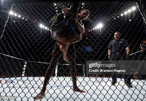 Krzysztof Jotko of Poland controls the body of Uriah Hall of Jamaica in their middleweight bout during the UFC Fight Night event inside the PPG...