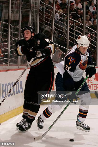 Colby Armstrong of the Atlanta Thrashers collides with Bobby Ryan of the Anaheim Ducks during the game on February 15, 2009 at Honda Center in...