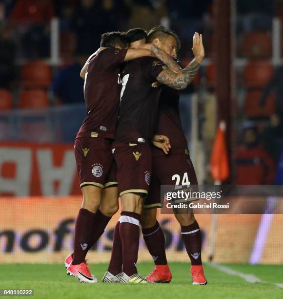 German Denis of Lanus apologizes to Independiente fans after scoring the winning goal of his team during a match between Independiente and Lanus as...