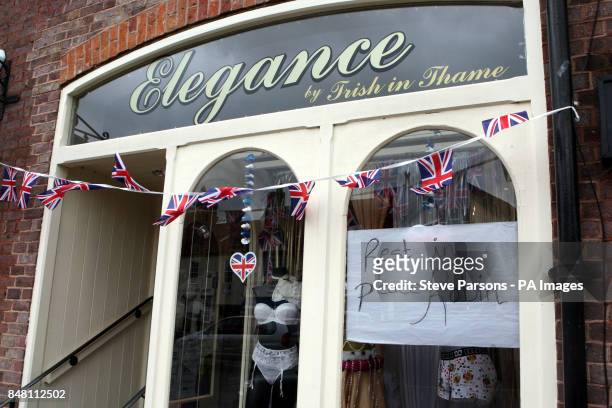 Message for Bee Gee Robin Gibb is seen in a lingerie shop as the funeral procession leaves his home in Thame, Oxfordshire ahead of his funeral at St...