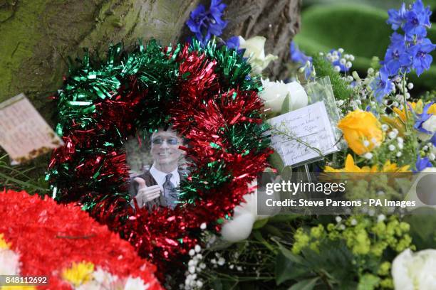 Flowers and a photo left at the funeral of Bee Gee Robin Gibb by his family at St Mary's Church in Thame, Oxfordshire.