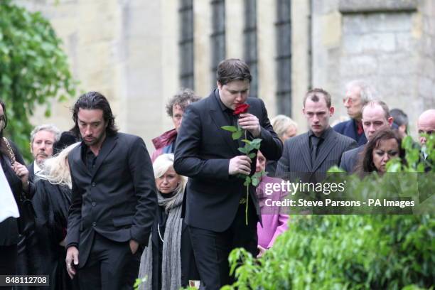 People leave flowers at the funeral of Bee Gee Robin Gibb at St Mary's Church in Thame, Oxfordshire. PRESS ASSOCIATION Photo. Picture date: Friday...