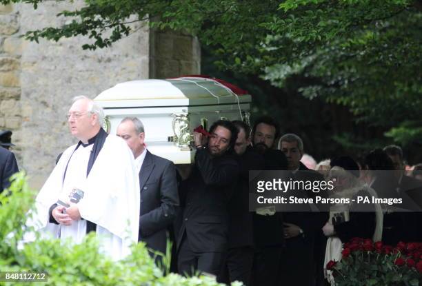 The coffin of Bee Gee Robin Gibb carried from his funeral service at St Mary's Church in Thame, Oxfordshire. PRESS ASSOCIATION Photo. Picture date:...
