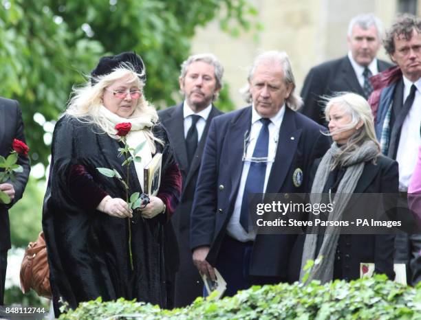 Dwina Murphy Gibb leaves flowers at the funeral of her husband Bee Gee Robin Gibb at St Mary's Church in Thame, Oxfordshire.