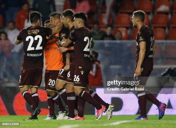 German Denis of Lanus celebrates with teammates after scoring the winning goal of his team during a match between Independiente and Lanus as part of...