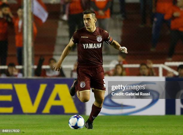 Maximiliano Velazquez of Lanus drives the ball during a match between Independiente and Lanus as part of the Superliga 2017/18 at Libertadores de...