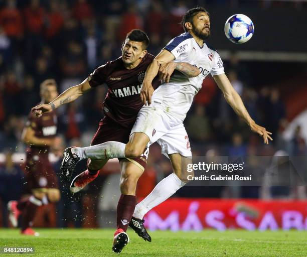 Jonas Gutierrez of Independiente fights for the ball with Leandro Maciel of Lanus during a match between Independiente and Lanus as part of the...