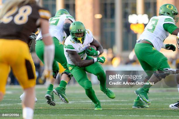 Royce Freeman of the Oregon Ducks runs against the Wyoming Cowboys during the first half on Saturday, September 16, 2017. The Wyoming Cowboys hosted...