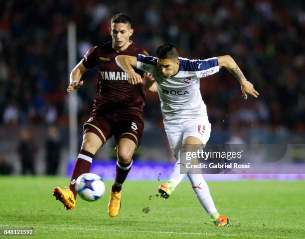 Leandro Fernandez of Independiente fights for the ball with Ivan Marcone of Lanus during a match between Independiente and Lanus as part of the...