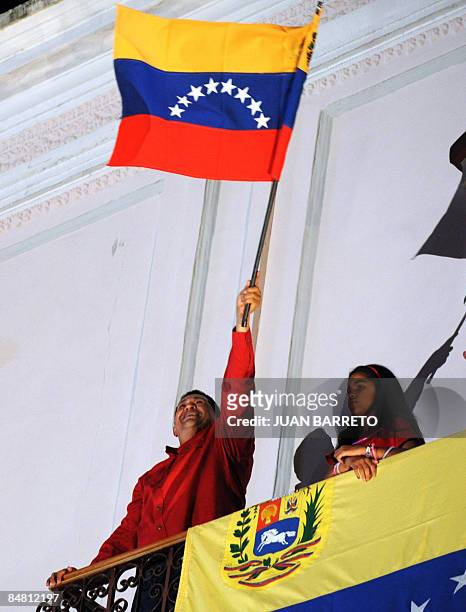 Venezuela's President Hugo Chavez celebrates his victory from the balcony of the Presidencial Palace in a referendum on constitutional changes would...
