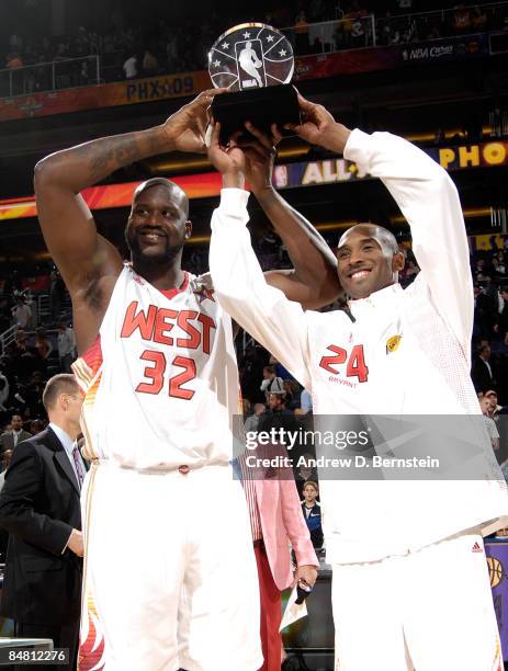 Shaquille O'Neal and Kobe Bryant of the Western Conference hold up the MVP trophy as they were named co-MVP's at the 58th NBA All-Star Game, part of...