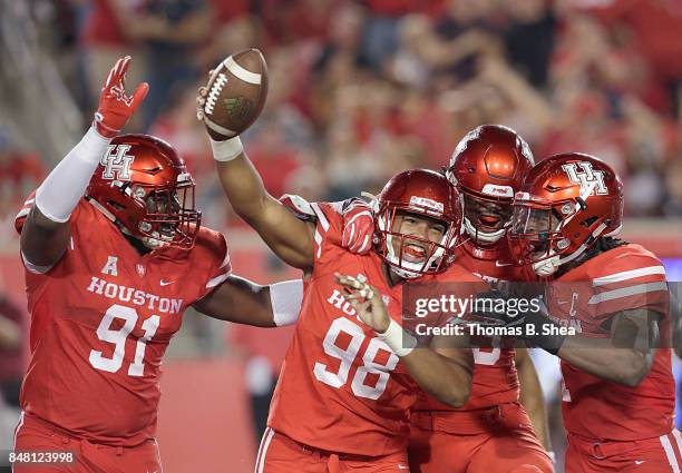 Payton Turner of the Houston Cougars celebrates intercepting a pass against the Rice Owls in the first quarter at TDECU Stadium on September 16, 2017...