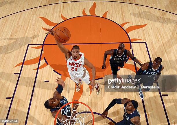 Tim Duncan of the Western Conference shoots over Dwight Howard of the Eastern Conference during the 58th NBA All-Star Game, part of 2009 NBA All-Star...