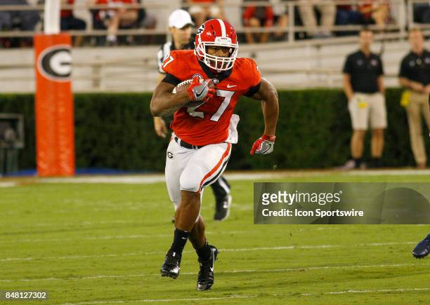 Georgia Bulldogs running back Nick Chubb makes a 20 yard gain early in the 1st quarter during the college football game between the University of...
