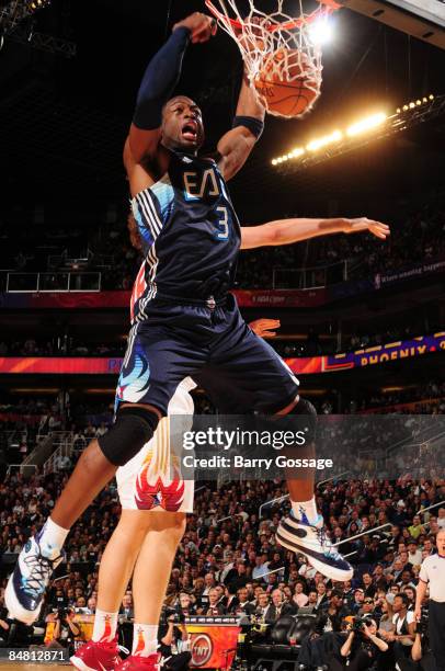 Dwyane Wade of the Eastern Conference dunks against Pau Gasol of the Western Conference during the 58th NBA All-Star Game, part of 2009 NBA All-Star...