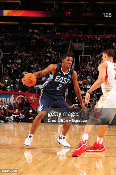 Joe Johnson of the Eastern Conference dribbles against Brandon Roy of the Western Conference during the 58th NBA All-Star Game, part of 2009 NBA...