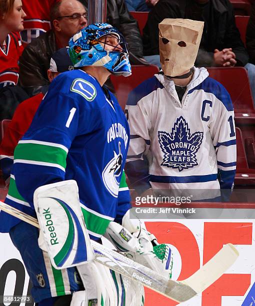Disgruntled Toronto Maple Leafs fan looks on as Roberto Luongo Vancouver Canucks skates in the warm up during their game against the Montreal...