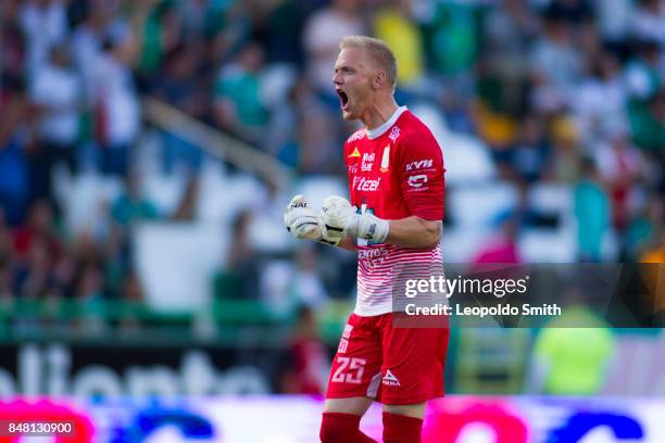 William Yarbrough of Leon celebrates celebrates the first goal of his team scored by his teammate Mauro Boselli during the 9th round match between...