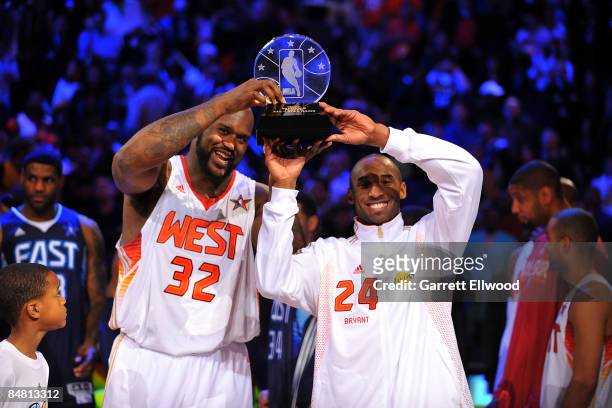 Shaquille O'Neal and Kobe Bryant of the Western Conference hold up the MVP trophy as they were named co-MVP's at the 58th NBA All-Star Game, part of...