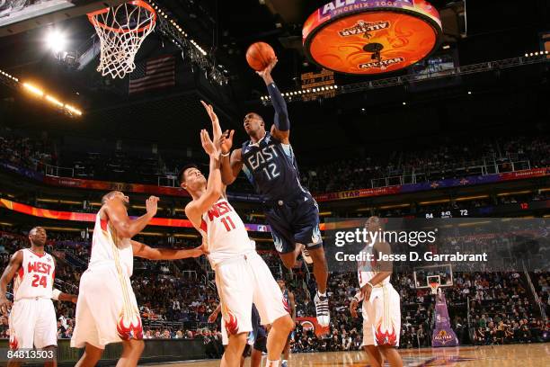 Dwight Howard of the Western Conference attempts a shot against Yao Ming of the Eastern Conference during the 58th NBA All-Star Game, part of 2009...