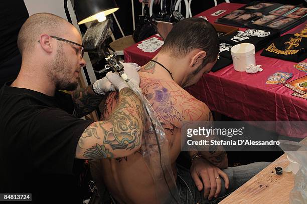 Man gets tattooed during the 14th Milano Tattoo Convention held at Ata Hotel on February 13, 2009 in Milan, Italy.
