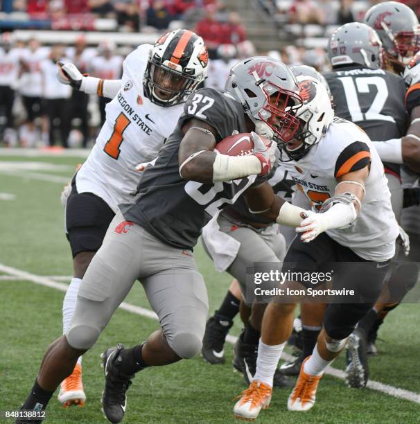 Washington State running back James Williams tries to get past Oregon State safety David Morris during the game between the Oregon State Beavers and...