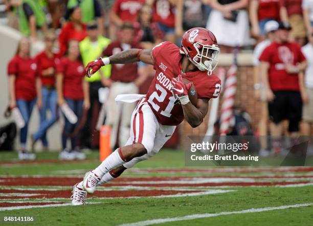 Running back Marcelias Sutton of the Oklahoma Sooners returns a punt against the Tulane Green Wave at Gaylord Family Oklahoma Memorial Stadium on...