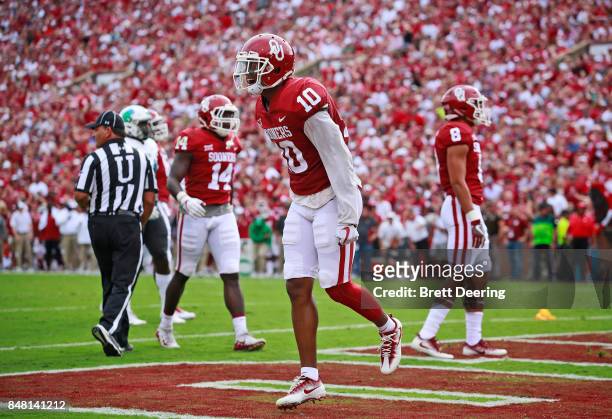 Defensive back Steven Parker of the Oklahoma Sooners celebrates a defensive play in the end zone against the Tulane Green Wave at Gaylord Family...