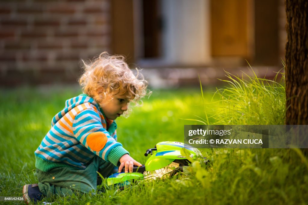 Toddler with toy car