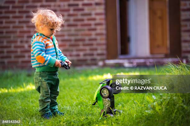 toddler with toy car - remote controlled fotografías e imágenes de stock