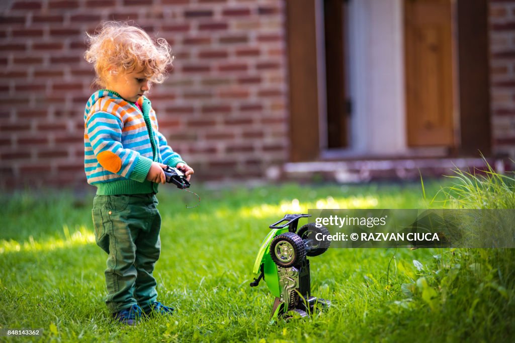 Toddler with toy car