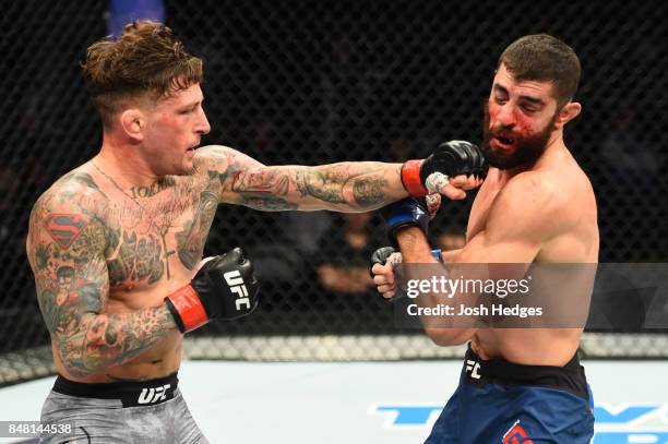 Gregor Gillespie punches Jason Gonzalez in their lightweight bout during the UFC Fight Night event inside the PPG Paints Arena on September 16, 2017...