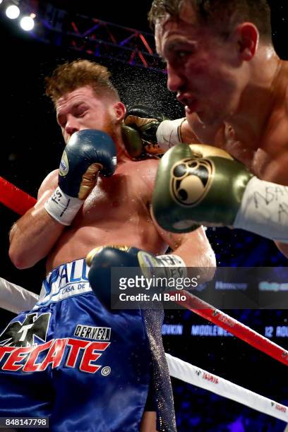 Gennady Golovkin throws a punch at Canelo Alvarez during their WBC, WBA and IBF middleweight championship bout at T-Mobile Arena on September 16,...