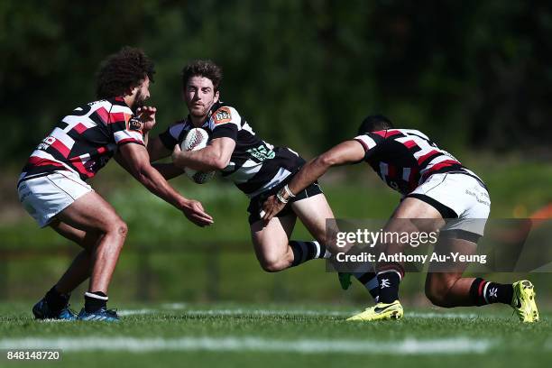 Mason Emerson of Hawke's Bay is tackled by Orbyn Leger and Nigel Ah Wong of Counties Manukau during the round five Mitre 10 Cup match between...