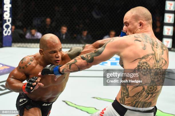 Hector Lombard of Cuba punches Anthony Smith in their middleweight bout during the UFC Fight Night event inside the PPG Paints Arena on September 16,...