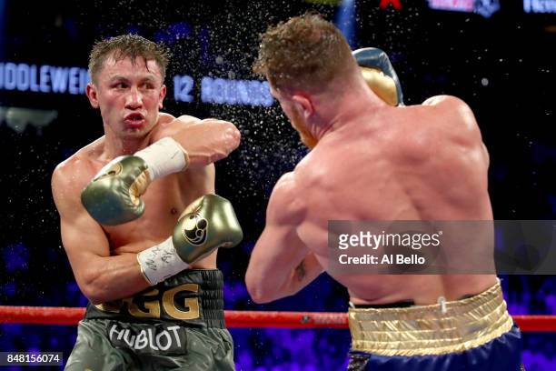 Gennady Golovkin throws a punch at Canelo Alvarez during their WBC, WBA and IBF middleweight championship bout at T-Mobile Arena on September 16,...