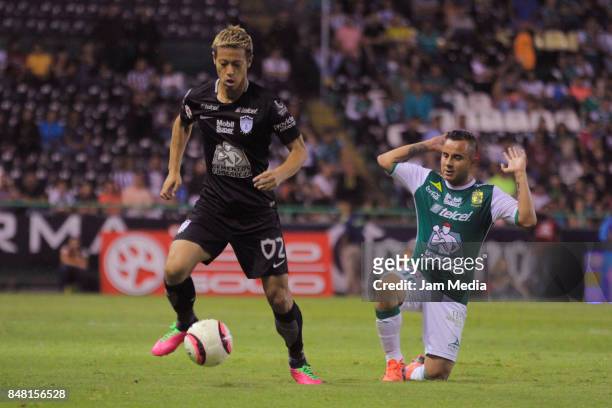 Keisuke Honda of Pachuca fights for the ball with Luis Montes of Leon during the 9th round match between Leon and Pachuca as part of the Torneo...
