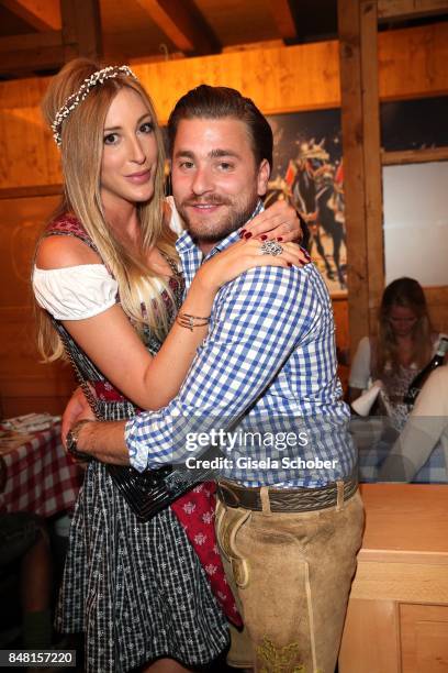 Singer Sebastian Buergin "Baschi" and his girlfriend Alana Netzer, daughter of Guenter and Elvira Netzer during the opening of the Oktoberfest 2017...