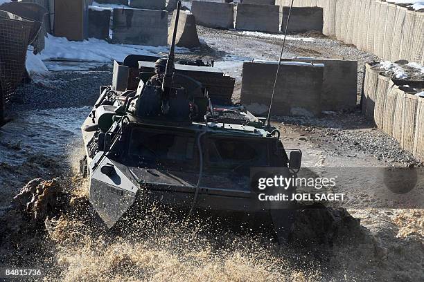 French Army VAB armoured personnel carrier drives through water as it arrives at Forward Operating Base Morales-Frazier in Nijrab in Afghanistan's...
