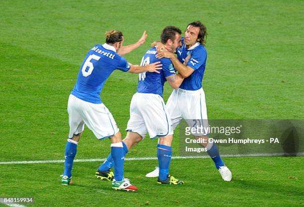 Italy's Antonio Cassano celebrates with team mates Andrea Pirlo and Federico Balzaretti after he scores the opening goal of the game