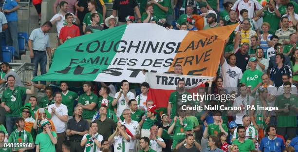Banner drawing attention to the Loughinisland atrocity is seen during the UEFA Euro 2012 Group match at the Municipal Stadium, Poznan, Poland.
