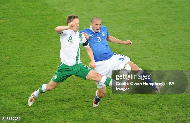 Republic of Ireland's Kevin Doyle battes for the ball with Italy's Giorgio Chiellini