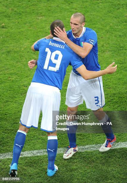 Italy's Giorgio Chiellini embraces Leonardo Bonucci as he is substituted off in place of his team mate